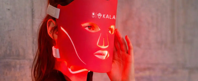 Kala Red Light Woman holding a red light device