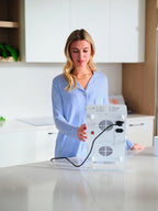 Woman holding a clear Kala Red Light Pro Panel delivers professional-grade red and near-infrared therapy for half-body coverage.