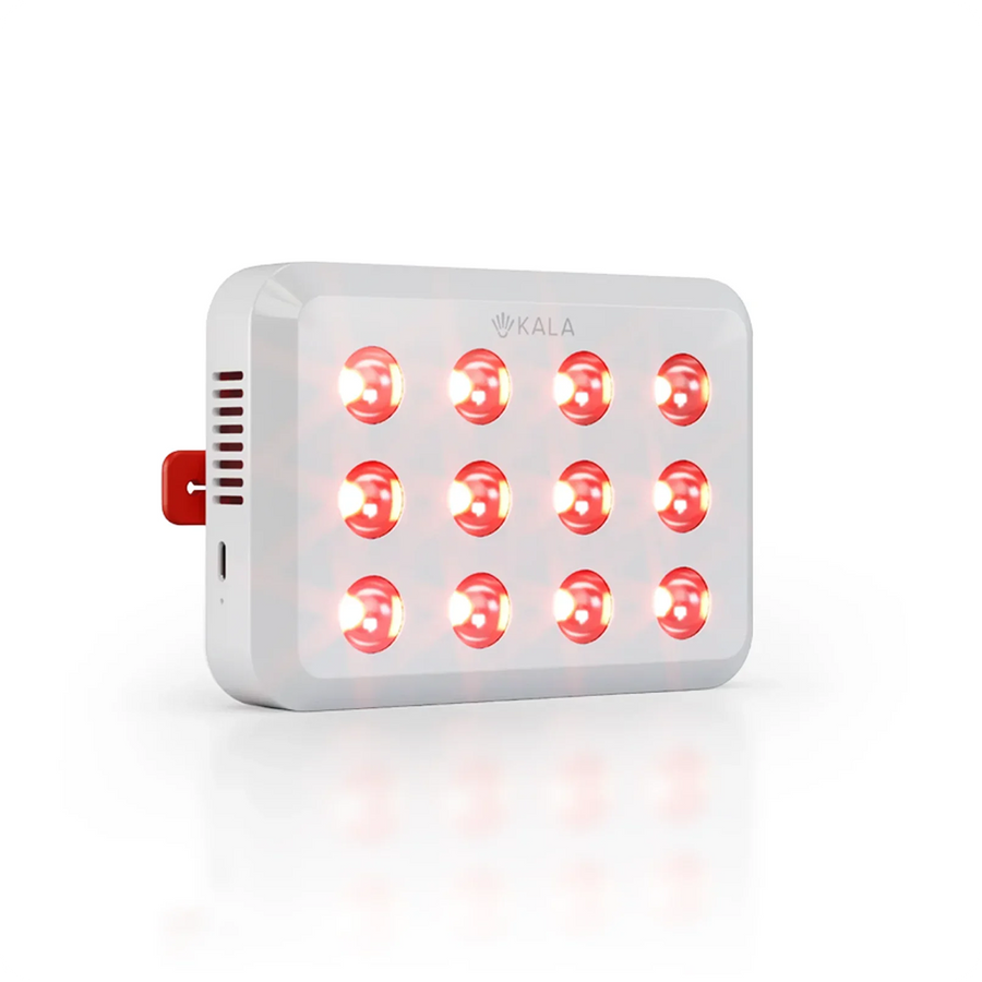 A KALA red light therapy panel with 15 glowing red LEDs, shown on a clean white background with a soft reflection.