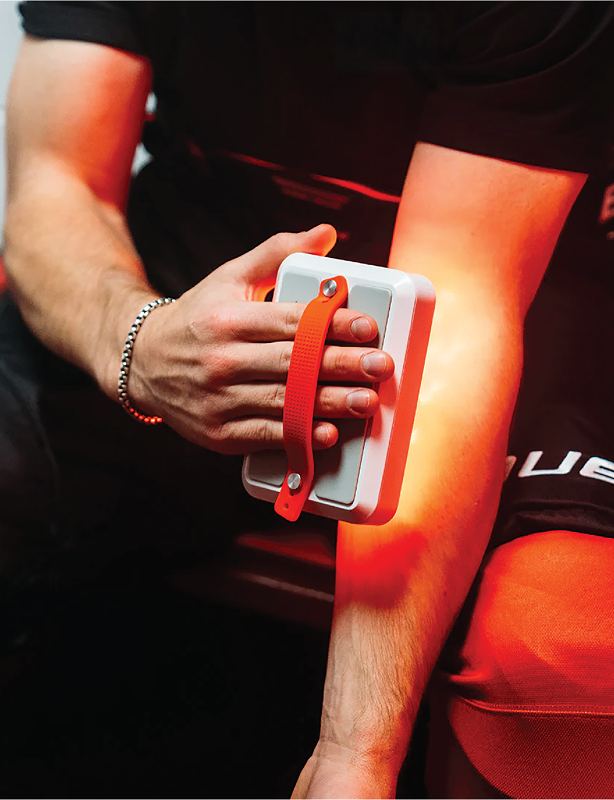 Person using a handheld kala Red Light Mini 2.0 delivers medical-grade red and near-infrared therapy in a compact, travel-ready design.