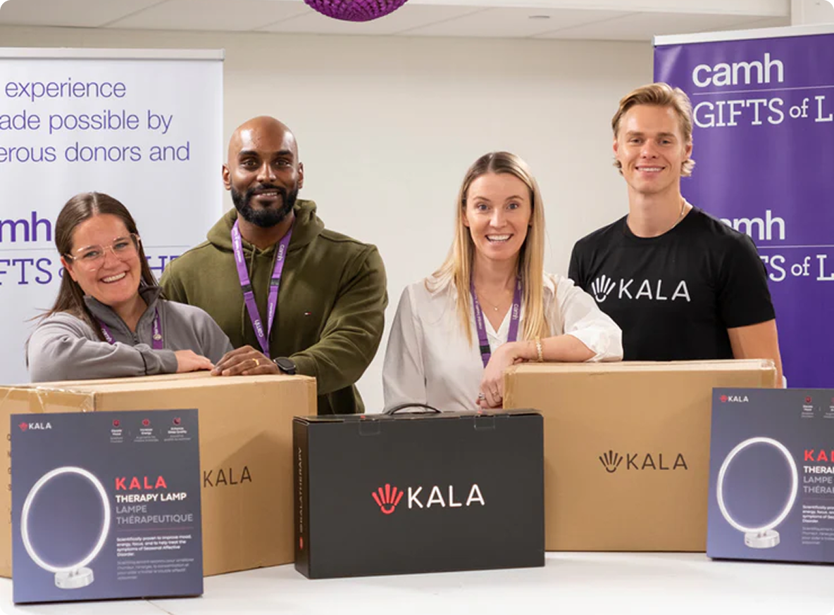 Group of people with KALA products and branding at an event with CAMH (Canadian Mental Health Association) signage.